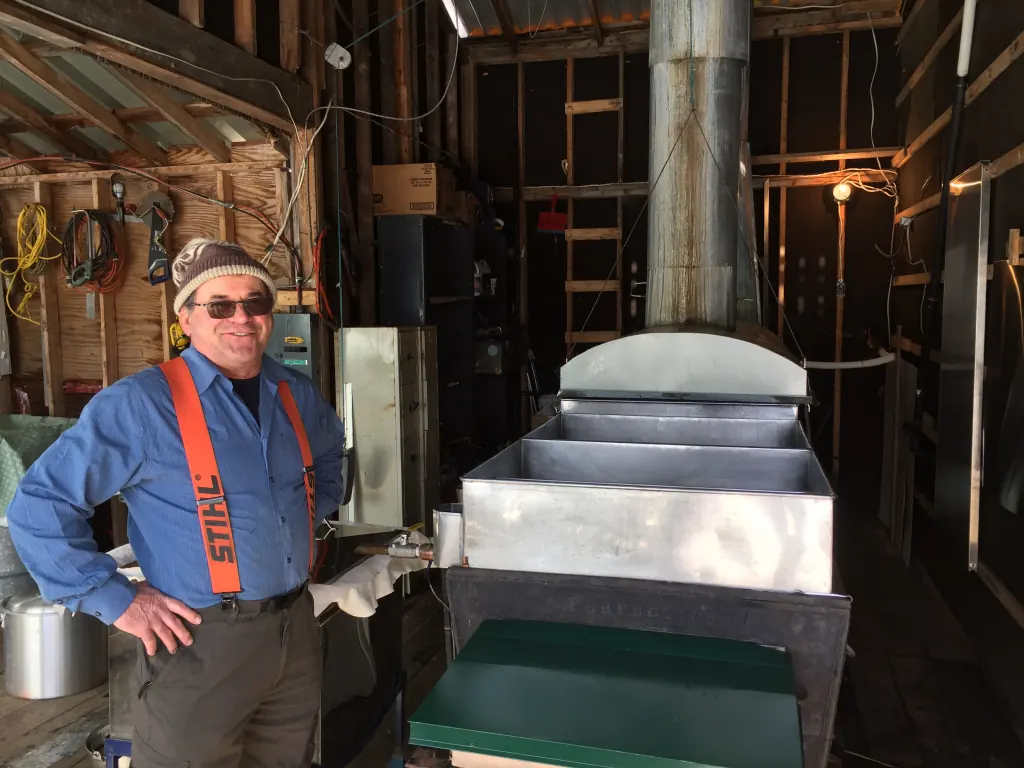 Maxime's father at the evaporator in the sugar shack